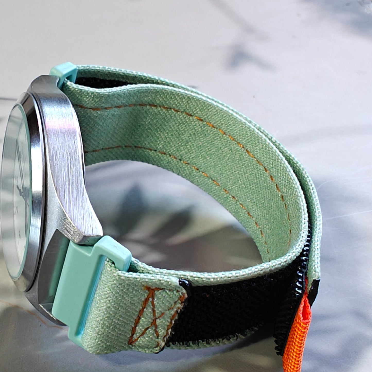Kellonranneke Loopsteri Canvas Nylon - tarrasäätö vaaleen vihreä