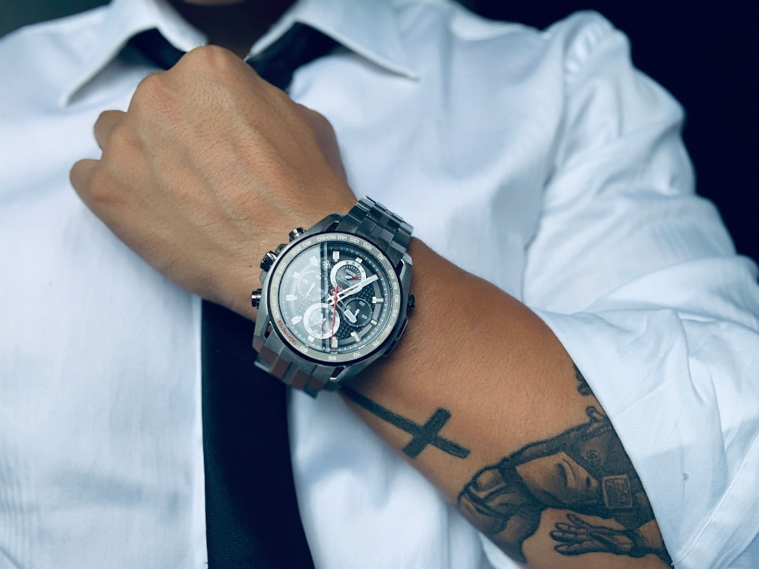 person wearing gray analog and digital watch