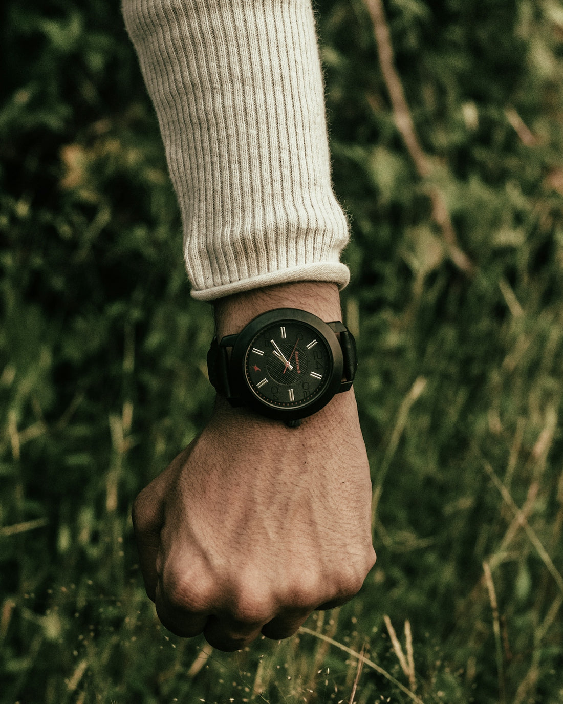 a person with a watch on their wrist