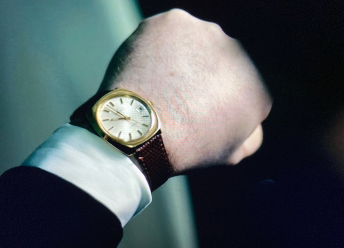 a close up of a person wearing a watch
