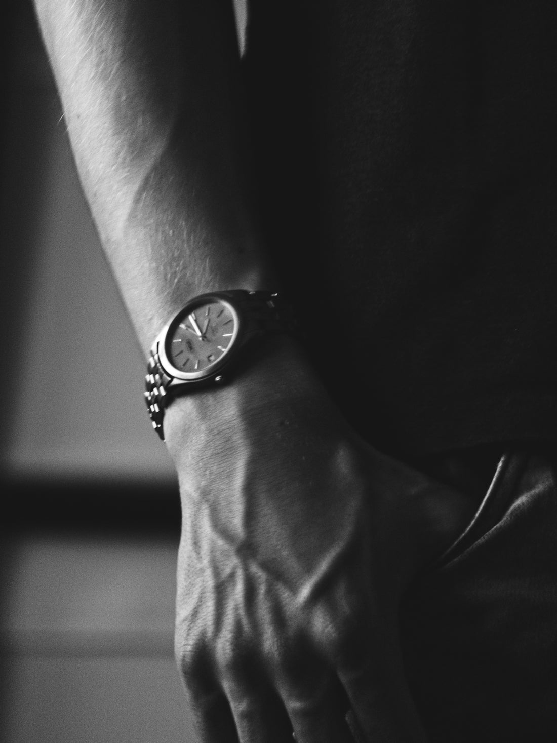 a person with a watch on their wrist