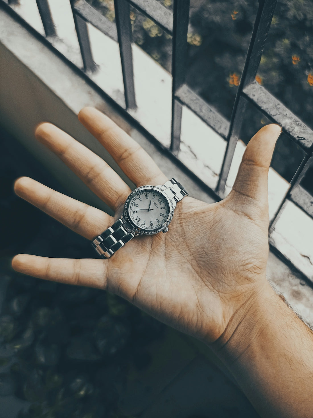 a person's hand with a watch on it