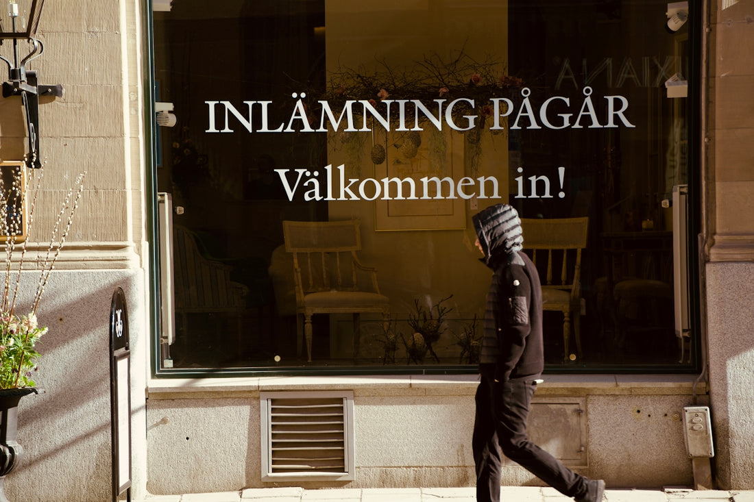 A person walks past a storefront window.