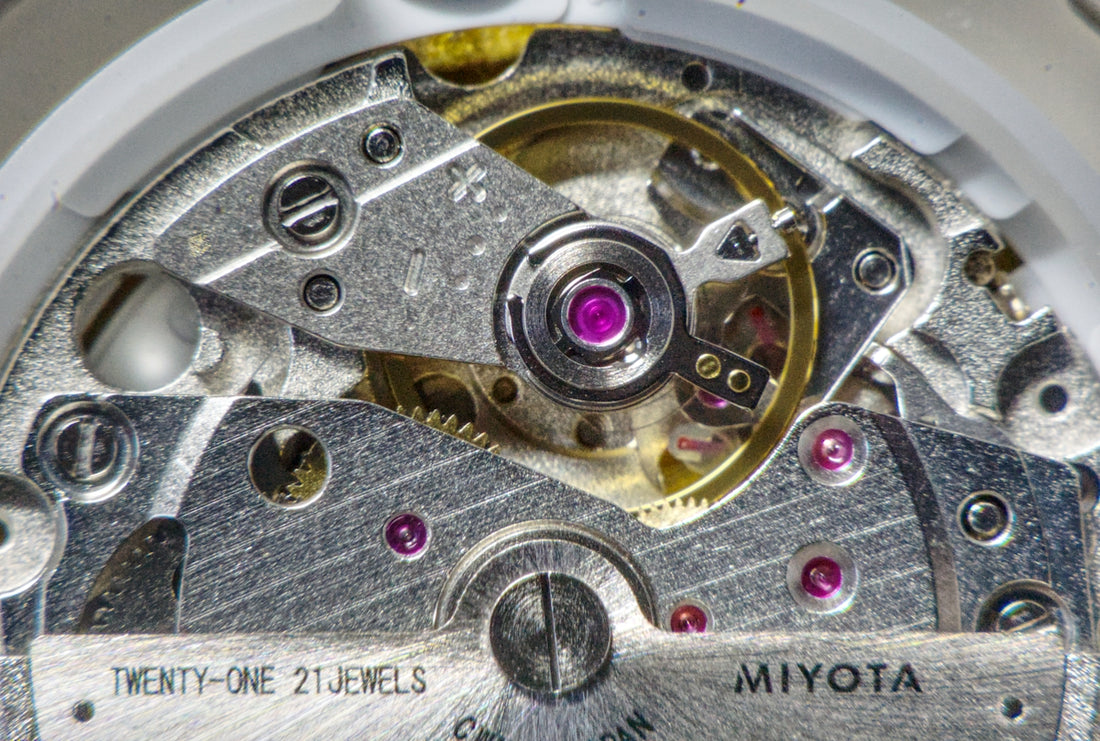 Close-up of a miyota watch movement with 21 jewels.